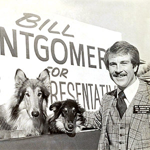 Bill Montgomery smiles next to sled dogs during his campaign for Indiana State Representative.