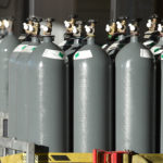 Grey compressed gas cylinders