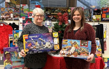 Celina employees Terry Rammel and Colleen Sharpin pose with donated Christmas presents for the Angel Tree program.