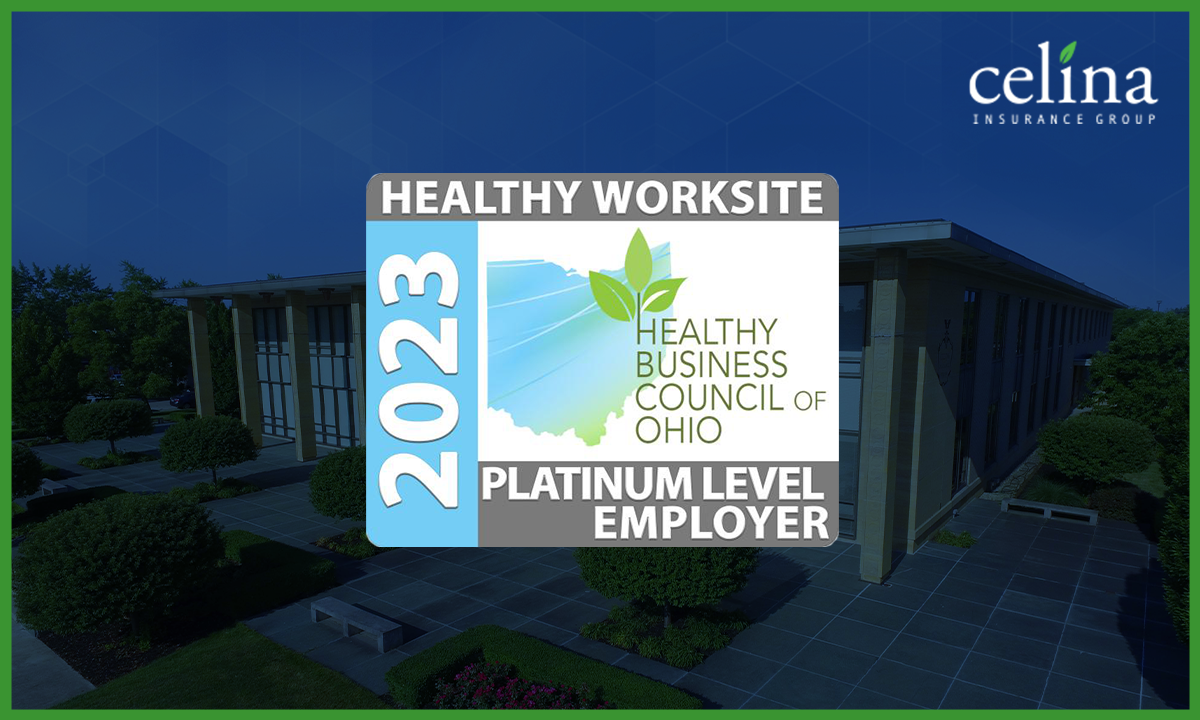 The Healthy Worksite logo, which reads "Healthy Worksite Platinum Level Employer 2023, Healthy Business Council of Ohio," is displayed in front of a background that features Celina Insurance Group's home office building.